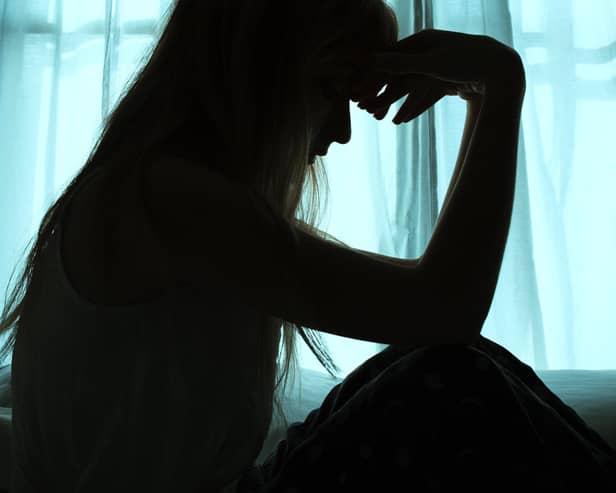 File image of the silhouette of a woman.