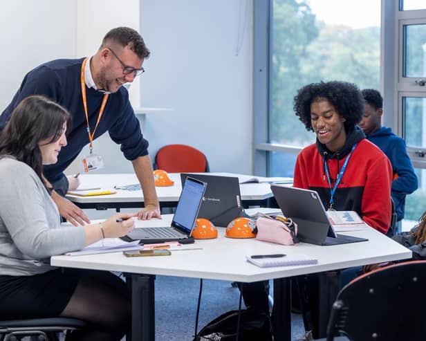 A level  teacher Tom Beach with students at Milton Keynes College. From left to right, Holly Couchman, Jehiel Nelson and Iyinoluwagbemi Akinyemi