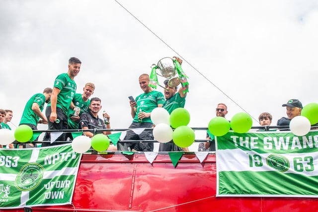 The town's Swans football team, who recently won the FA Vase, were the stars of the parade on an open topped bus