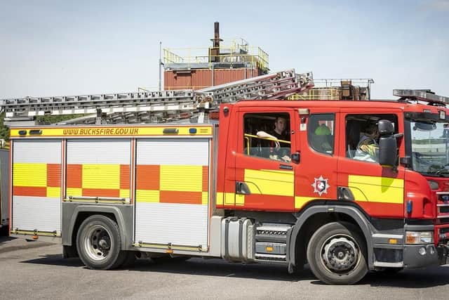A woman was treated for her injuries following a garage fire in the early hours of Monday