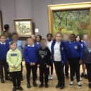 Year 4 pupils at Langland Community School, pictured in front of the piece of artwork at The National Gallery which inspired their work.
