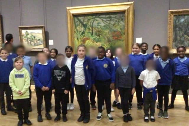 Year 4 pupils at Langland Community School, pictured in front of the piece of artwork at The National Gallery which inspired their work.