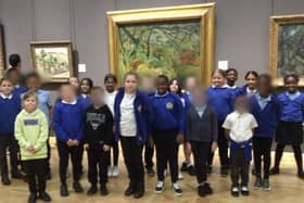 Year 4 pupils at Langland Community School, pictured in front of the piece of artwork at The National Gallery which inspired their work.