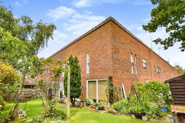 The house is a corner terrace on an L-shaped plot