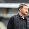 Mark Jackson was sacked on Tuesday after Dons were relegated to League Two on Sunday
