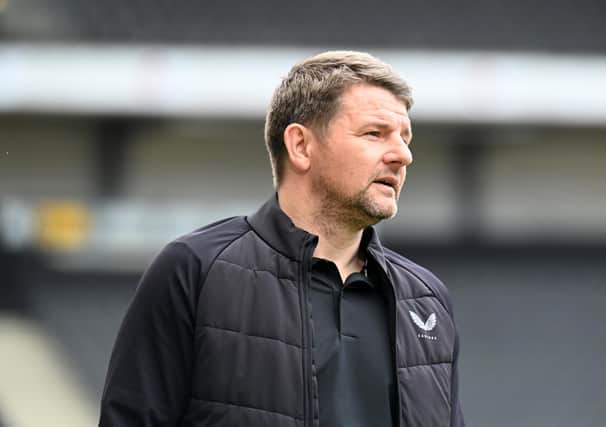 Mark Jackson was sacked on Tuesday after Dons were relegated to League Two on Sunday