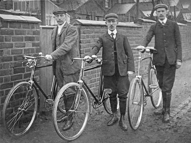 Three gentlemen pose with their bicycles at the roadside, Stony Stratford, now part of Milton Keynes.