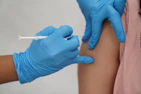 A a person receiving a Covid-19 jab