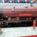 The model of the Queen naming a train after Milton Keynes