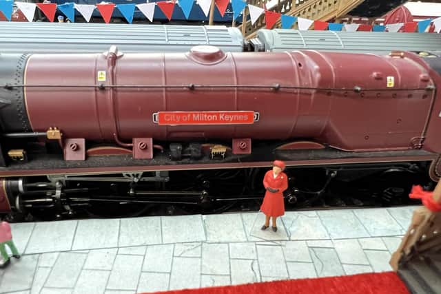 The model of the Queen naming a train after Milton Keynes