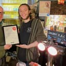David Martin of CAMRA presents the Phoenix award to Owen Tottey of the Chequers PH, Fenny Stratford