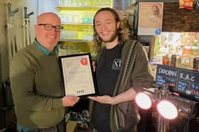 David Martin of CAMRA presents the Phoenix award to Owen Tottey of the Chequers PH, Fenny Stratford
