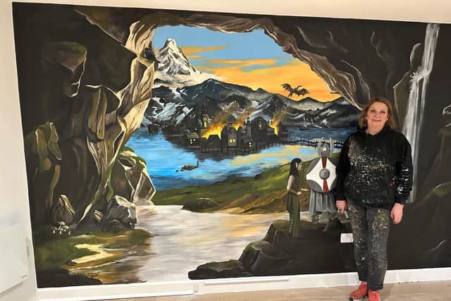 Muralist Sarah Hodgkins with her Tolkien inspired mural