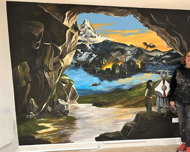 Muralist Sarah Hodgkins with her Tolkien inspired mural