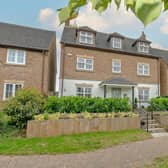 This impressive property offers spacious accommodation set across three floors with landscaped garden and double garage with parking area in the gated rear.