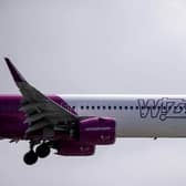A Wizz Air jet comes in to land (Photo by BEN STANSALL/AFP via Getty Images)