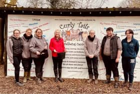 Cllr Zoe Nolan with staff and volunteers at Curly Tails Pig Sanctuary.