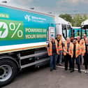 Some of the Suez team pose with their new vehicles in Milton Keynes