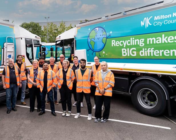 Some of the Suez team pose with their new vehicles in Milton Keynes