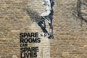 The mural on the historic Milton Keynes farmhouse states that spare rooms can spare lives