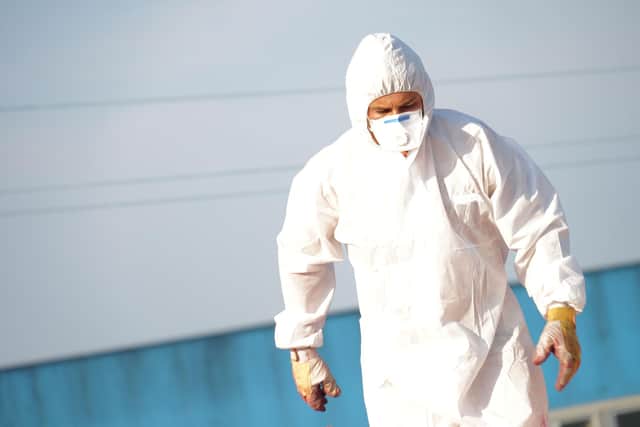 Worker in full PPE