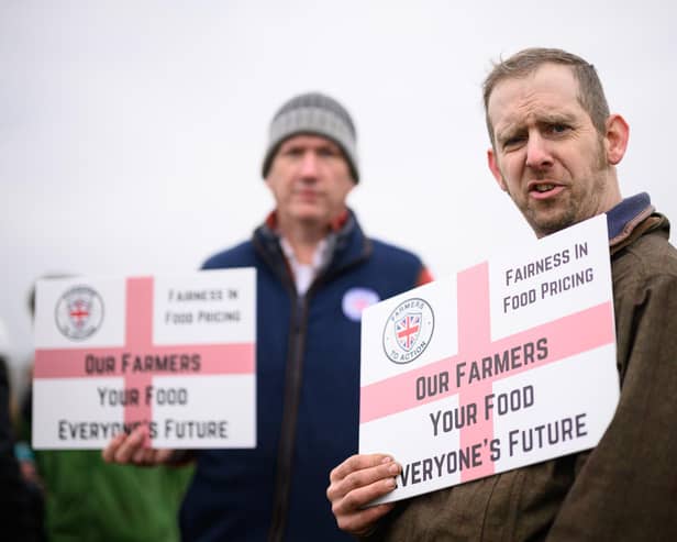 Protesters at Keir Starmer's Milton Keynes visit. (Photo by Leon Neal - WPA Pool/Getty Images)