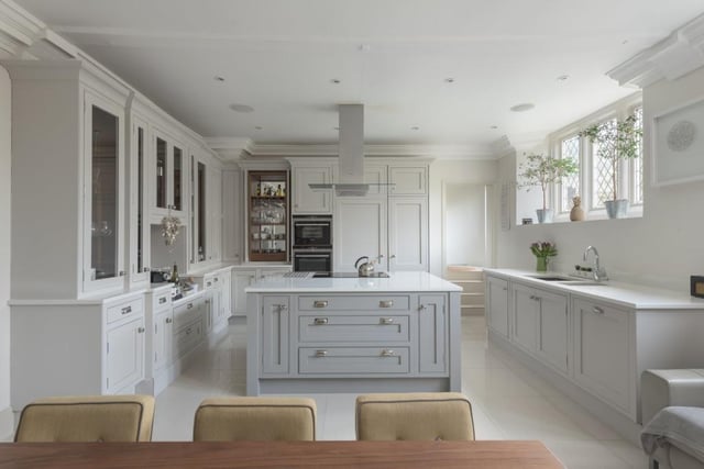 Cooking and entertaining is a joy in this beautiful kitchen which boats top of the range Siemens appliances built into handmade, painted furniture, with quartz worktops