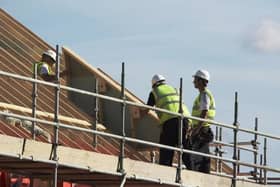 File picture of construction workers. Photo by Damian Gillie/Construction Photography/Avalon/Getty Images