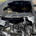 The wreckage of Jackie's car after the fire was put out