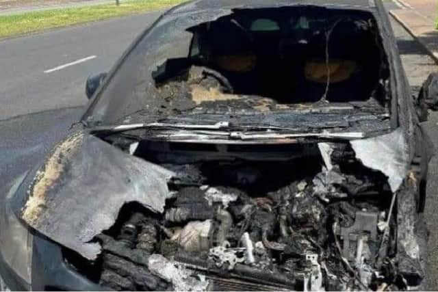 The wreckage of Jackie's car after the fire was put out