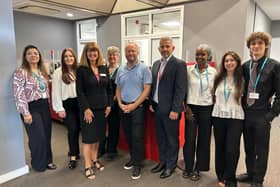 Post Office chief executive Neil Brocklehurst visits a temporary branch opened at Milton Keynes City Council's offices following a fire at the Midsummer Boulevard site last month