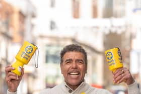 Chris Kamara helping with Leeds bucket collection.