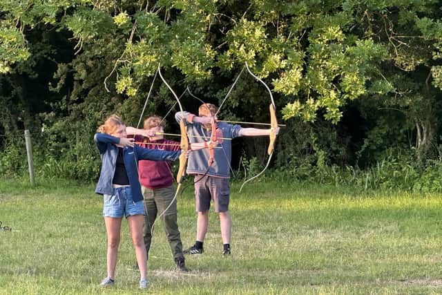 Explorers trying archery