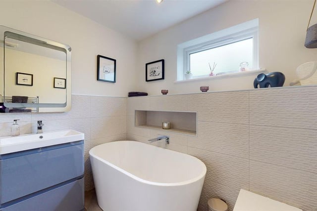 The refitted four-piece suite comes with a shower cubicle and freestanding bath.