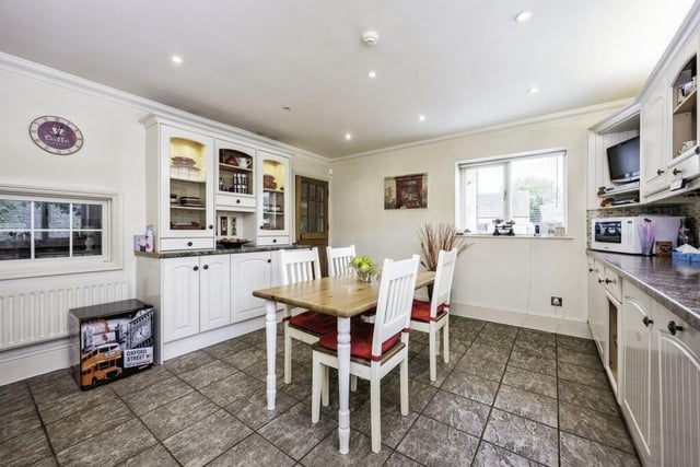The kitchen breakfast room is fitted with a range of wall and base units with work surfaces, 1 1/2 bowl sink with drainer, tiling to splash back areas, space for a range cooker, cooker hood, ceramic tiled flooring, double glazed window to rear and side.