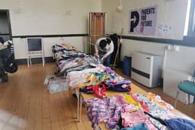Local parents host a children's clothing swap to promote sustainability and local climate action.