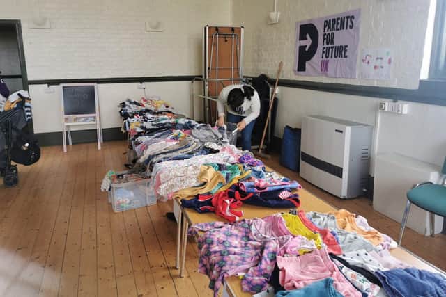 Local parents host a children's clothing swap to promote sustainability and local climate action.