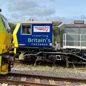 Two of the special trains used by Network Rail to clear tracks of fallen leaves