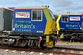 Two of the special trains used by Network Rail to clear tracks of fallen leaves