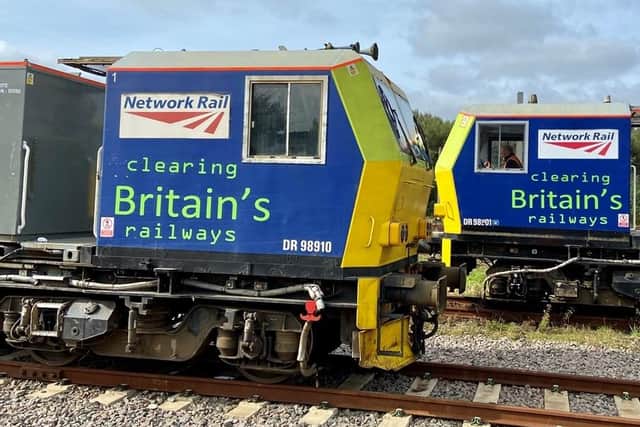 Two of the special trains used by Network Rail to clear tracks of fallen leaves