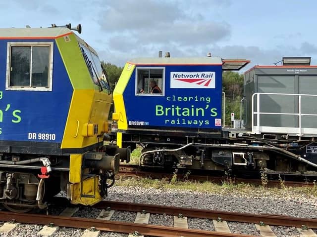 Two of the special trains used by Network Rail to clear tracks of fallen leaves