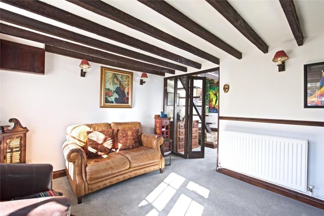 The living room leads to a conservatory