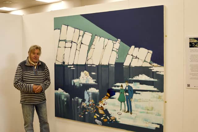 Jack Watto and one of eight canvases on climate change. This one highlights melting glaciers, warming oceans and pollution.