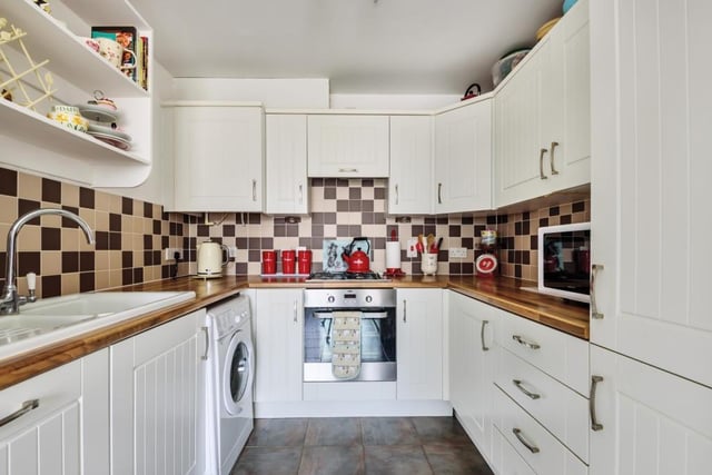 The re-fitted kitchen boasts a range of units with integrated appliances