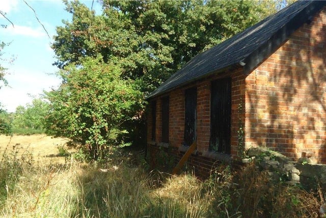 The property is brick built with a slate roof