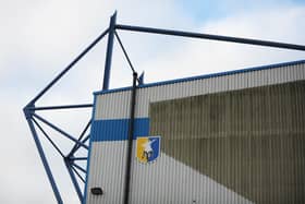 Mansfield's Field Mill stadium was deemed waterlogged ahead of the game with MK Dons today (Saturday)