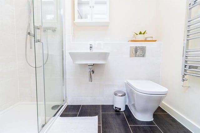The en-suite bathroom is fitted with shower cubicle, wash hand basin, wall hung wc, heated towel rail, and extractor fan