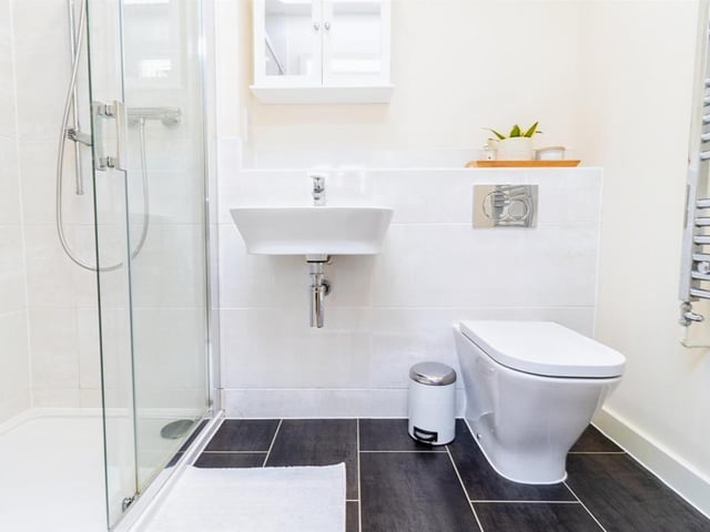 The en-suite bathroom is fitted with shower cubicle, wash hand basin, wall hung wc, heated towel rail, and extractor fan