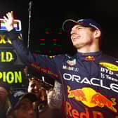 SUZUKA, JAPAN - OCTOBER 09: Race winner and 2022 F1 World Drivers Champion Max Verstappen of Netherlands and Oracle Red Bull Racing celebrates with his team after the F1 Grand Prix of Japan at Suzuka International Racing Course on October 09, 2022 in Suzuka, Japan. (Photo by Mark Thompson/Getty Images )