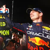 SUZUKA, JAPAN - OCTOBER 09: Race winner and 2022 F1 World Drivers Champion Max Verstappen of Netherlands and Oracle Red Bull Racing celebrates with his team after the F1 Grand Prix of Japan at Suzuka International Racing Course on October 09, 2022 in Suzuka, Japan. (Photo by Mark Thompson/Getty Images )